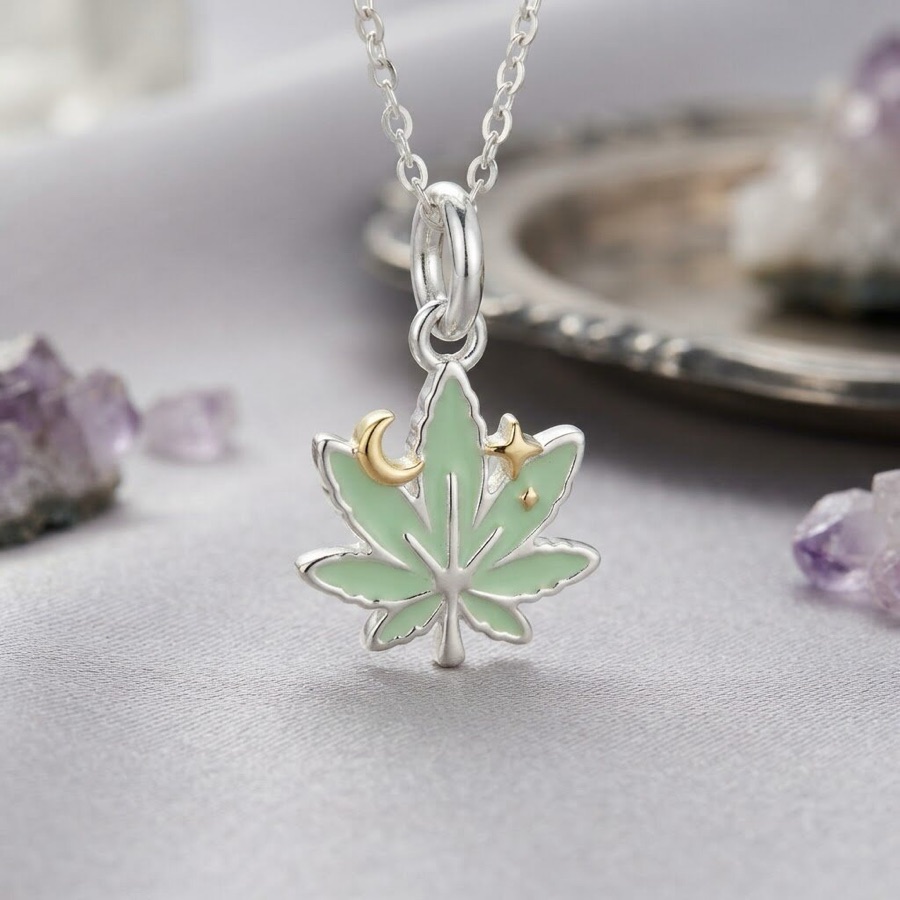 Sparkle leaf charm — sage green enamel leaf with a gold crescent moon and star
